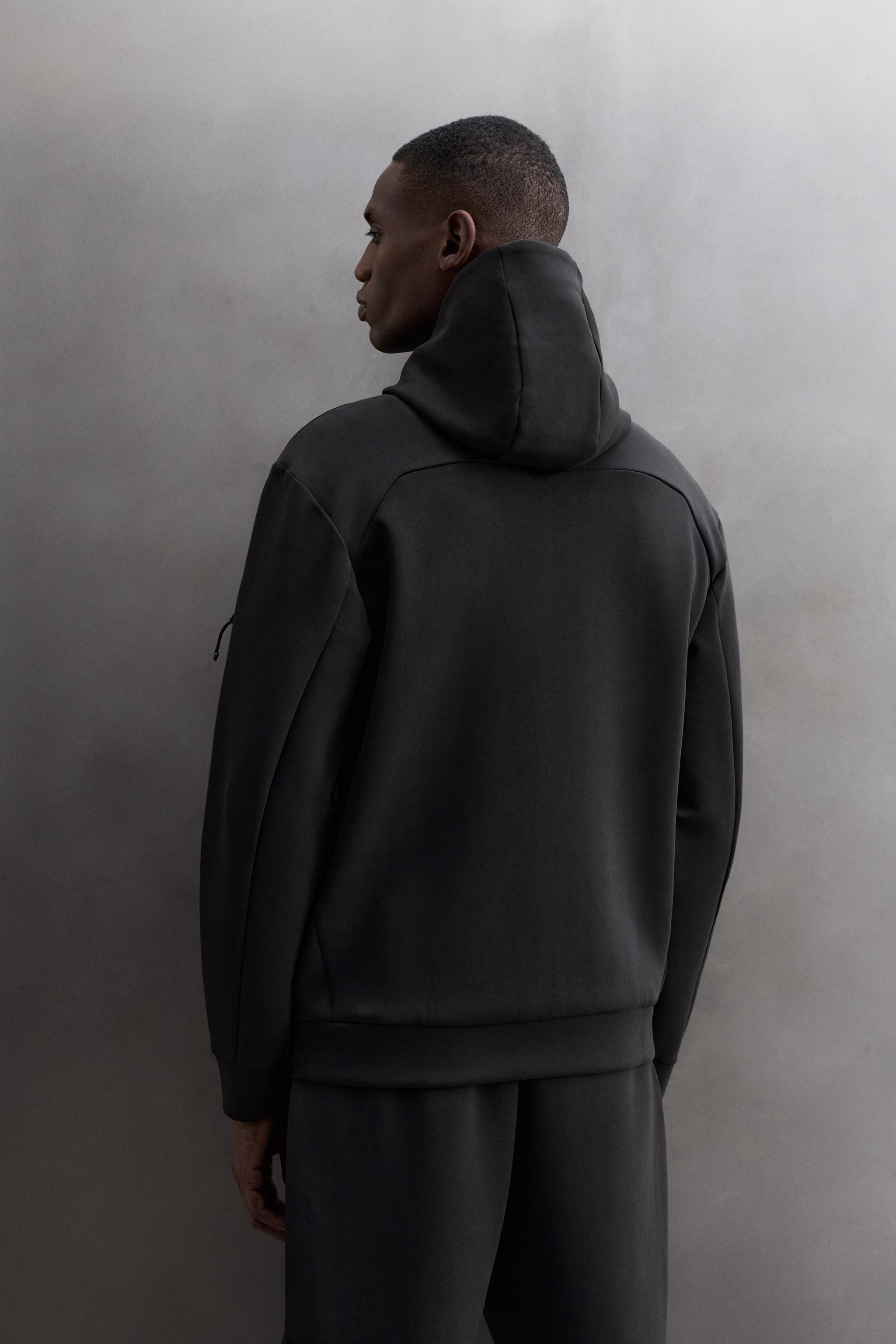 TECHNICAL ZIP-UP HOODIE